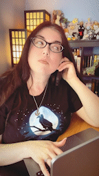 GIF of storyteller Kat Vancil sitting at her MacBook waiting on hold for something awesome.